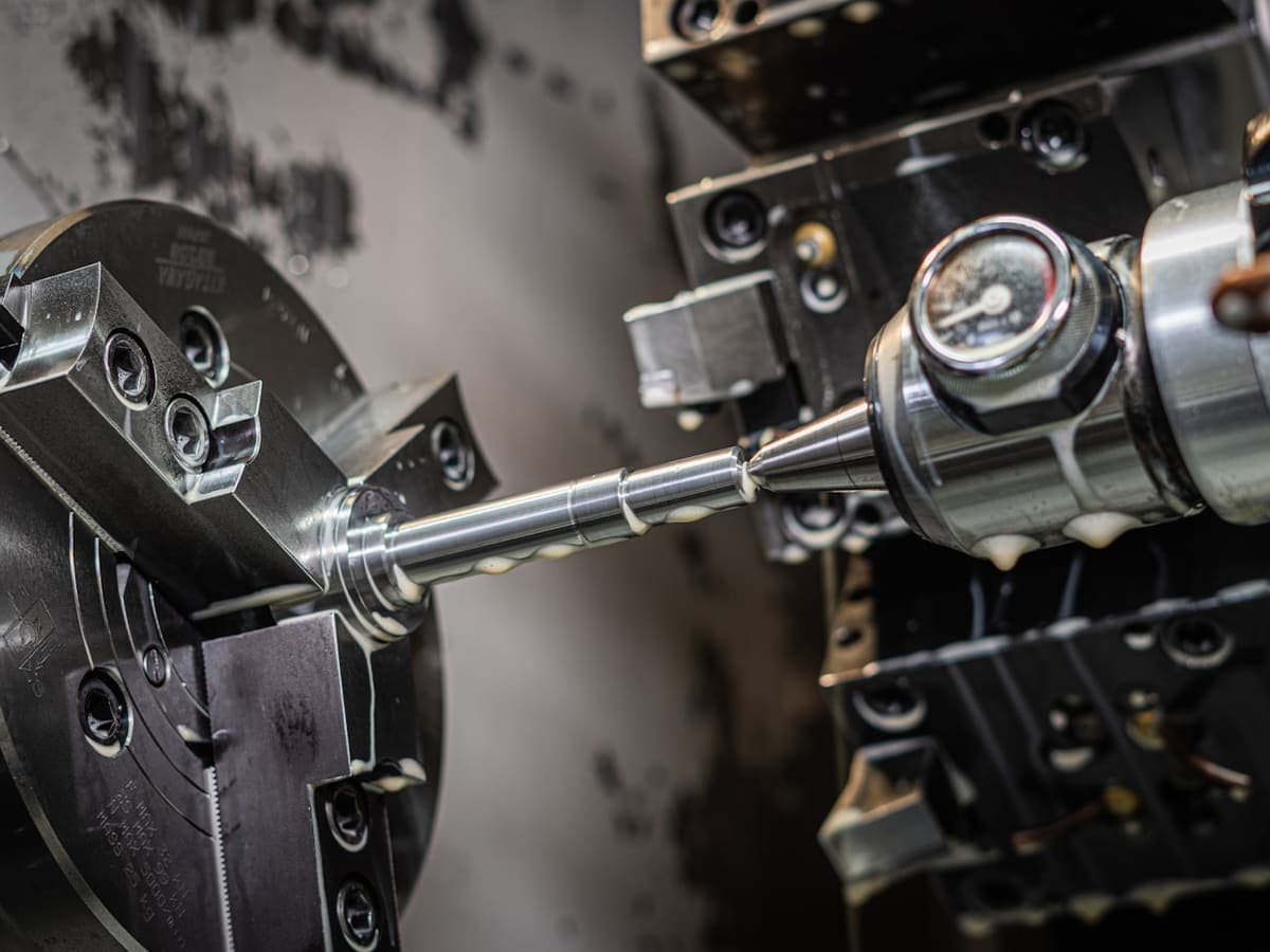 Close-up of a precision metal component being machined
